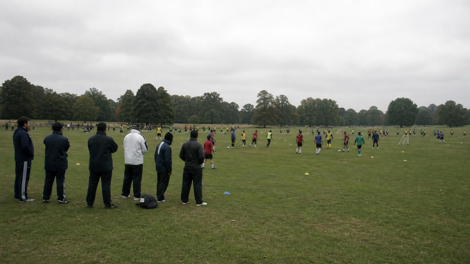 A large group of amateur footballers taking part in open trials on Wimbledon Common in 2002