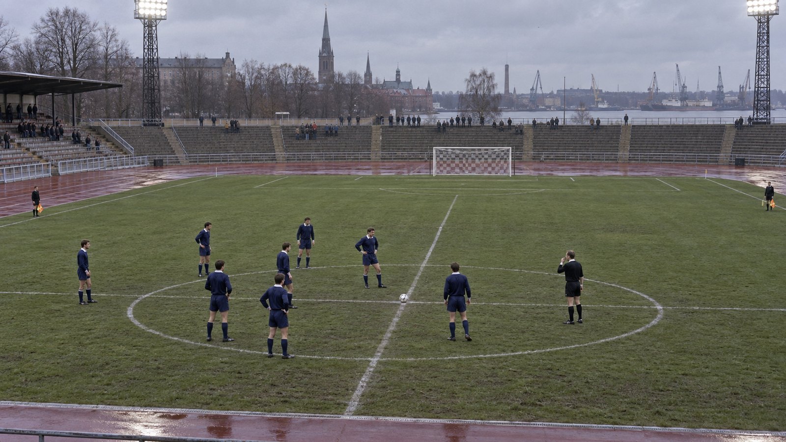A fictional Scottish team kicking off toward an empty half in a 1990s stadium